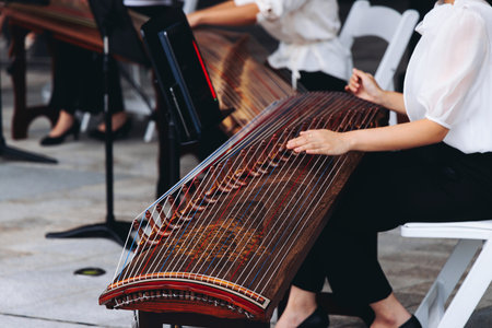 Traditional Korean folk musical instrument Gayageum, female orchestra band performing concert on...