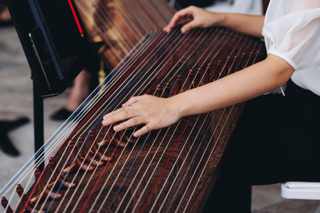 Traditional Korean folk musical instrument Gayageum, female orchestra band performing concert on...