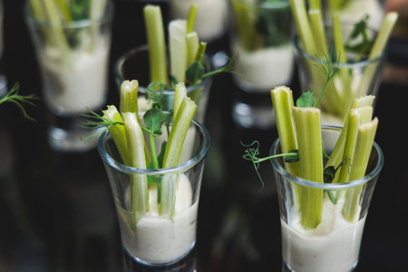 Beautifully decorated catering banquet table with variety of vegetables and different vegetarian...