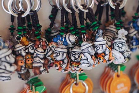 Tourist gifts and Korean souvenirs from Jeju Island, Jeju-do, South Korea, tangerine hallabong figures in orange color, knitted toys, fridge magnets, key ring keychain, a local gift vendor shop market