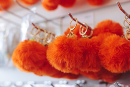 Tourist gifts and Korean souvenirs from Jeju Island, Jeju-do, South Korea, tangerine hallabong figures in orange color, knitted toys, fridge magnets, key ring keychain, a local gift vendor shop market