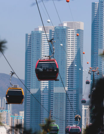 Busan Air Cruise, Busan cable car, ride on multicoloured sky capsule gondola route, with Songdo beach and Skywalk and Busan Bay panorama, South Korea, Songdo Station in a spring sunny day