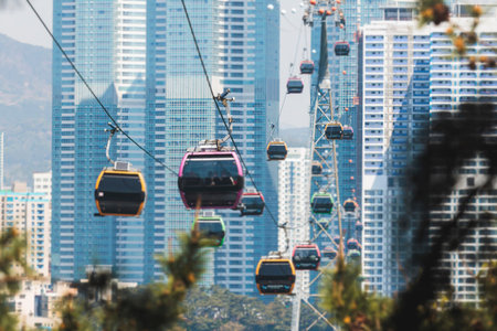 Busan Air Cruise, Busan cable car, ride on multicoloured sky capsule gondola route, with Songdo beach and Skywalk and Busan Bay panorama, South Korea, Songdo Station in a spring sunny day