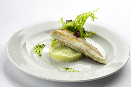 Seabass on mashed lemon and fennel salad with herbsの写真素材