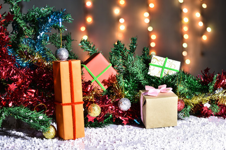 Gift Box in christmas day with christmas tree and Blur light Background.の写真素材