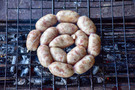 Grilled sausages on charcoal stove thai foods.の写真素材