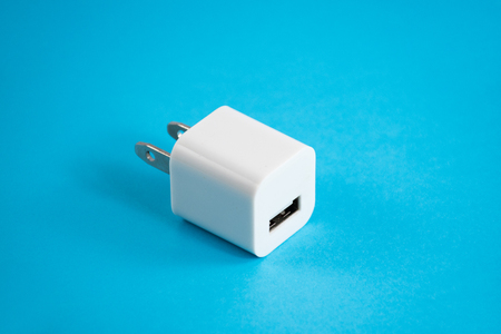 Smartphone Charger usb plug on blue background.の写真素材