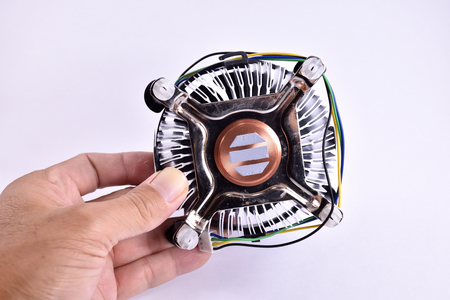 CPU fan and heat sink for computer in hand on white background.の写真素材