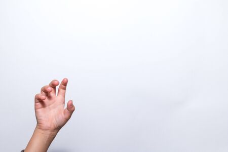 A hand holding something like a bottle on white background, hand gesture