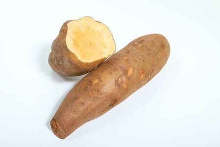 Yacon root (Smallanthus sonchifolius) close up, isolated on white backgroundの写真素材