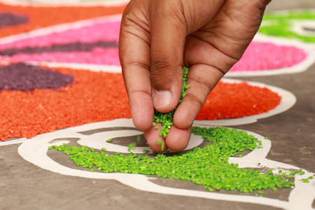 Traditional colorful kolam, rangoli decorated by handの写真素材