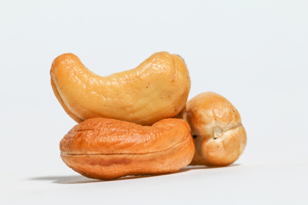 Cashews, cashew nuts (Anacardium occidentale) isolated on white background