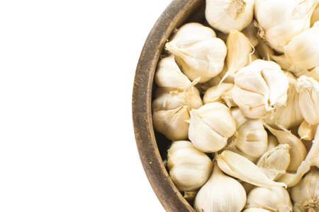 Background of Garlic in the circle wood trayの写真素材
