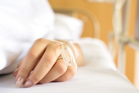 closeup of a Patient hand with Disposable Infusionの写真素材