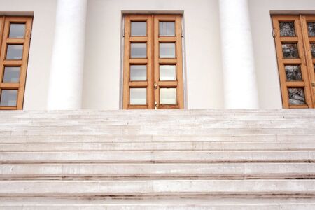 Marble stairs leading to three doors.の写真素材