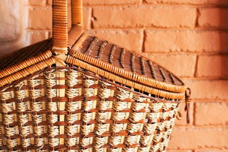 part of basket on terra-cotta wall background. close-upの写真素材