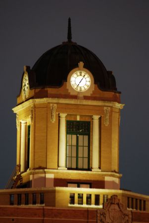 A photo of a clock tower taken at nightの写真素材