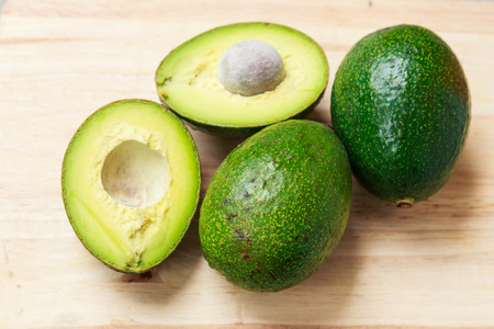 Avocados on woodの写真素材