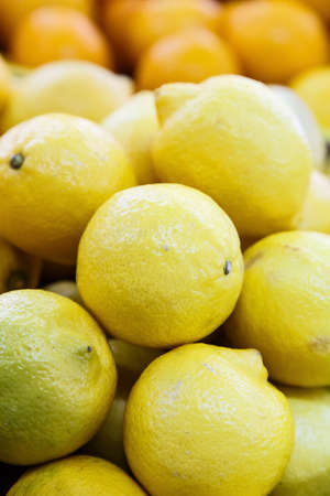 pile of fresh orange fruit in the fruit marketの写真素材