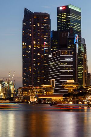 Buildings in Singapore city in night scene background , Singapore - 17 Jan 2015のeditorial素材