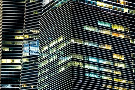 windows office building at nightの写真素材