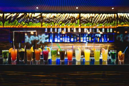many different cocktails prepared by at the bar