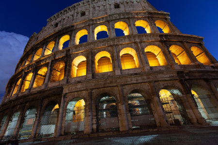 rome, italy, colosseum old ancient building gladiator battle at nightのeditorial素材