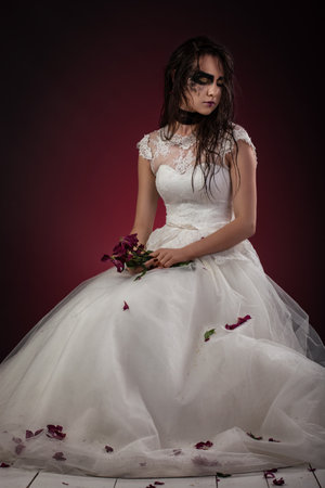 bride in a wedding dress with a black gothic makeup