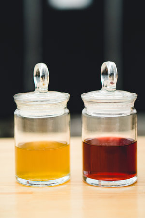 two beautiful jars of colored liquidの写真素材
