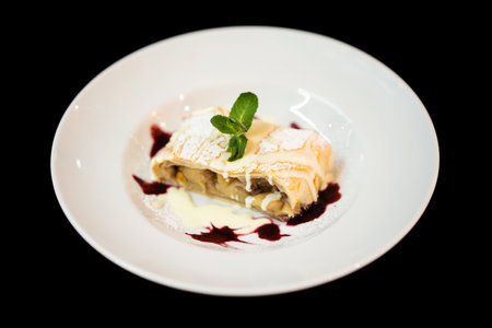 close up of delicious sweet dessert with mint leaf on a plateの写真素材