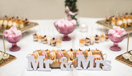 beautifully decorated table with sweet candy bar