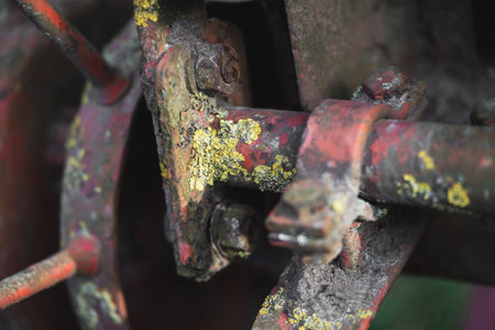 old rusty metal spare parts for work in agriculture
