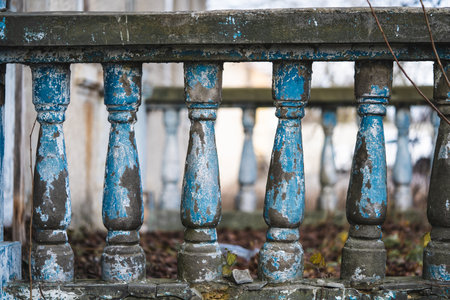 a balustrade on the railing of an old cracked staircaseの写真素材
