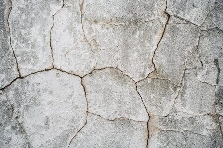 close up texture of cracked plaster on old house wallの写真素材