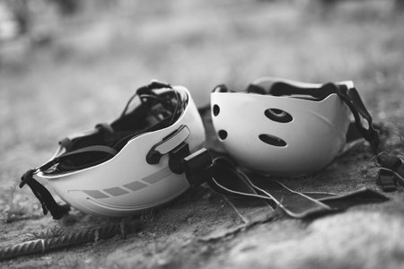 two helmets on the head of climbers on the groundの写真素材