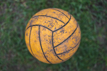 close up of a volleyball ball on the grassの写真素材