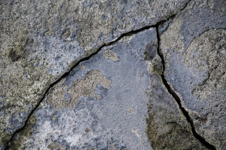 close up texture of cracked plaster on the wall