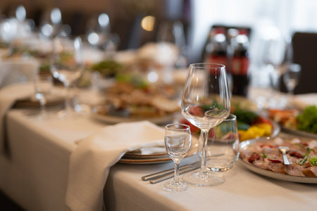 empty glasses on the banquet table in the restaurantの写真素材