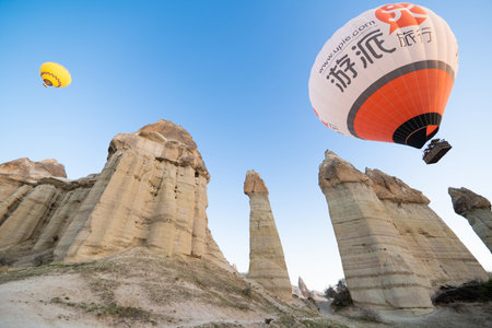 beautiful scenery flight of balloons in the mountains of Cappadocia in love valleyの写真素材