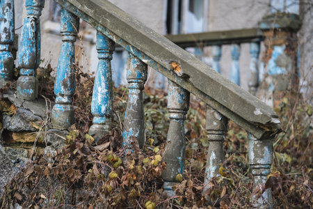 a balustrade on the railing of an old cracked staircaseの写真素材