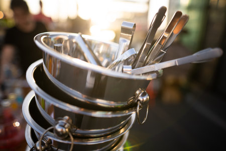 metal ice bucket on bar counter with ice scoop toolの写真素材