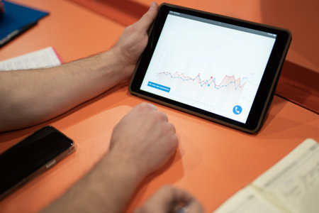 close up of tablet screen with growth chart