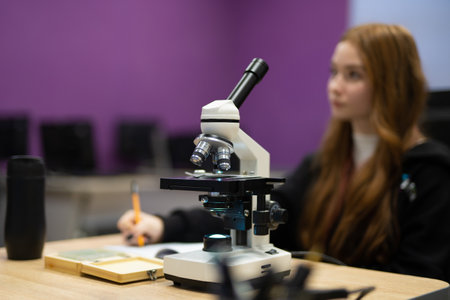 professional microscope in a school laboratory for the study of cells and bacteriaの写真素材