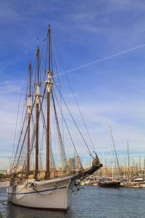 beautiful ships and boats are moored near the shore