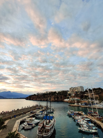 beautiful ships and boats are moored near the shoreの写真素材