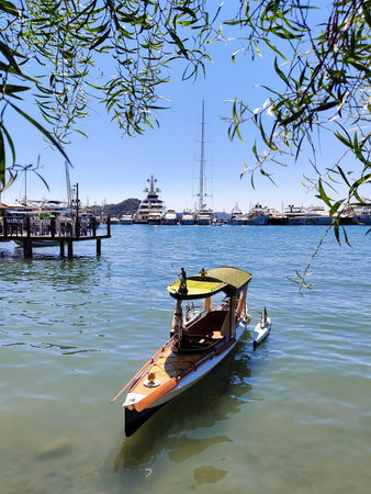 beautiful ships and boats are moored near the shoreの写真素材