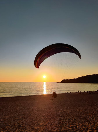 beautiful landscape with a view of the sea flying on a paragliderの写真素材