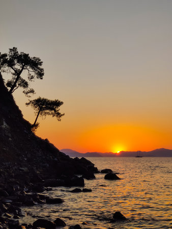 beautiful dramatic landscape of sunset on the sea beachの写真素材