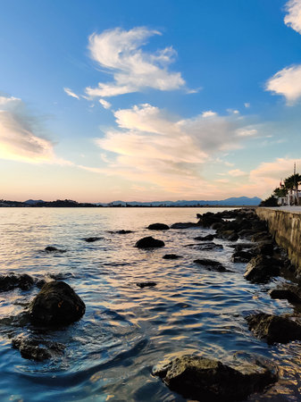 beautiful landscape of big stones in the water on the seashoreの写真素材