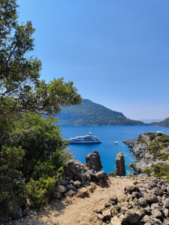 beautiful ships and boats are moored near the shoreの写真素材